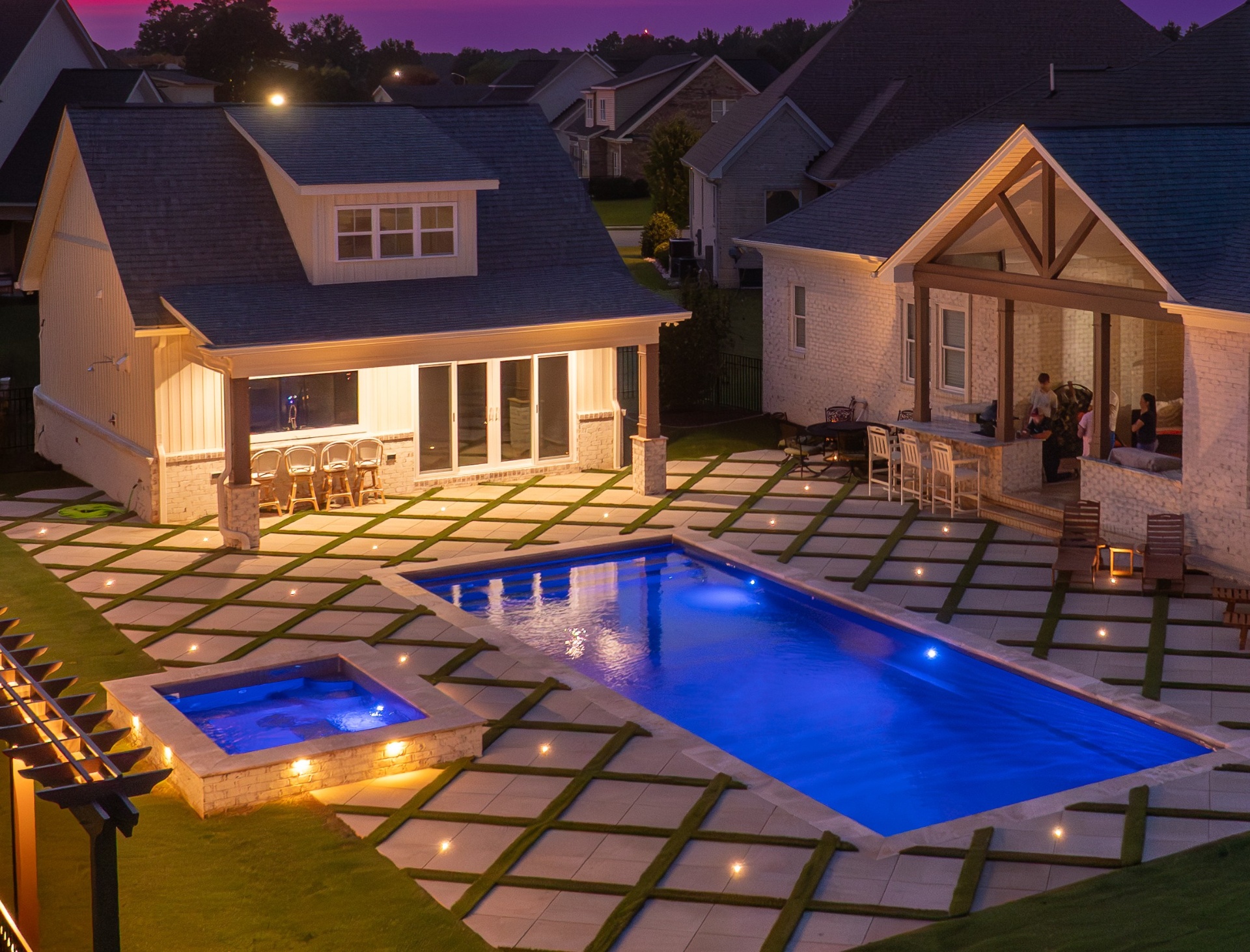 Completed Bluevue Outdoor Living pool and outdoor environment at dusk in Eastern North Carolina